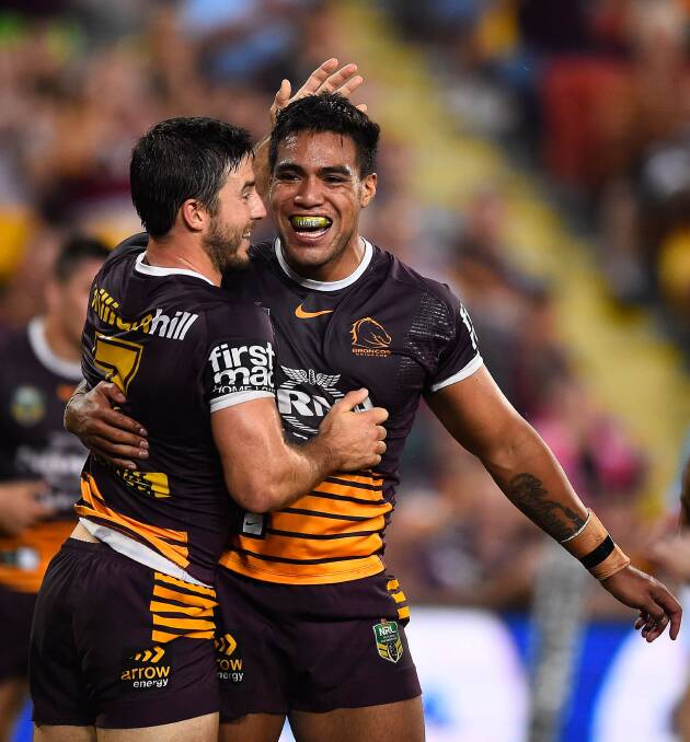 BRISBANE, AUSTRALIA - APRIL 16: Joe Ofahengaue of the Broncos celebrates after scoring a try with Ben Hunt of the Broncos during the round seven NRL match between the Brisbane Broncos and the Newcastle Knights at Suncorp Stadium on April 16, 2016 in Brisbane, Australia. (Photo by Ian Hitchcock/Getty Images)