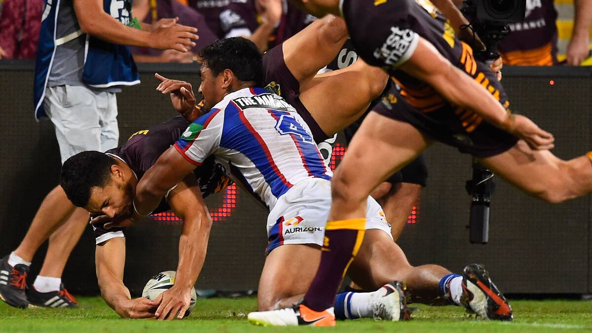BRISBANE, AUSTRALIA - APRIL 16: Jordan Kahu of the Broncos scores a try during the round seven NRL match between the Brisbane Broncos and the Newcastle Knights at Suncorp Stadium on April 16, 2016 in Brisbane, Australia. (Photo by Ian Hitchcock/Getty Images)