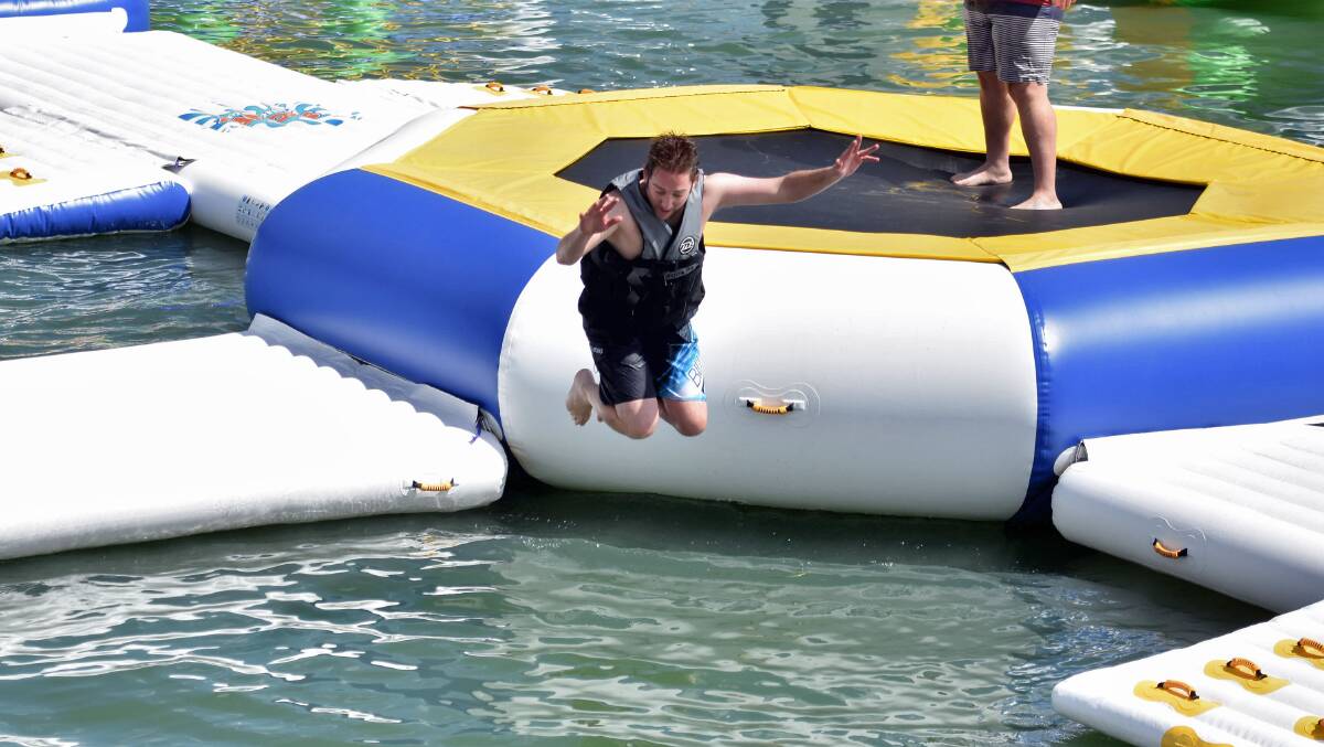 Paul Jobber launches from the trampoline into the water at Stoney Aqua Park.
