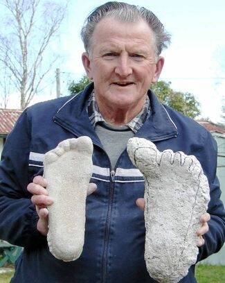 Rex Gilroy with some plaster footprint casts collected by the Australian Yowie Research Centre in Katoomba.
