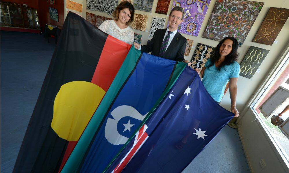 Federal MP David Gillespie was at Gangga Marrang Cultural Indigenous Corporation to present Australian, Aboriginal and Torres Strait Islander flags. He is pictured with Leisa Simms and Sonya Varagnolo.
