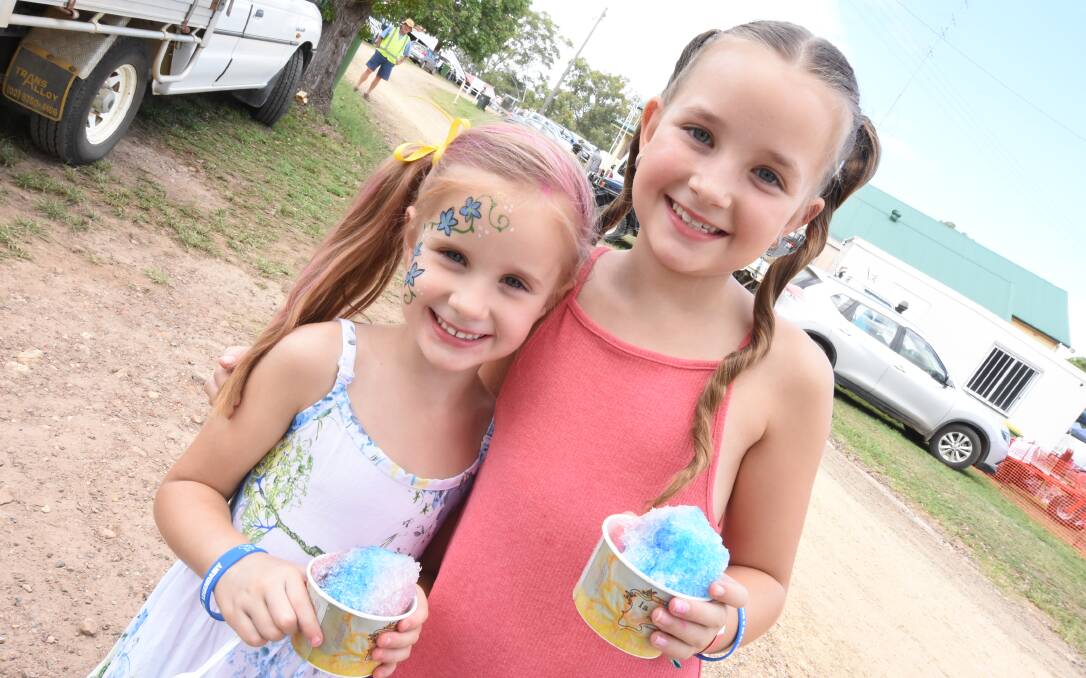SHOW TIME: Bella and Holly Atkins enjoy snow cones at the 2018 Wingham Show. This year's show will be on March 30 and 31. Photo: Scott Calvin