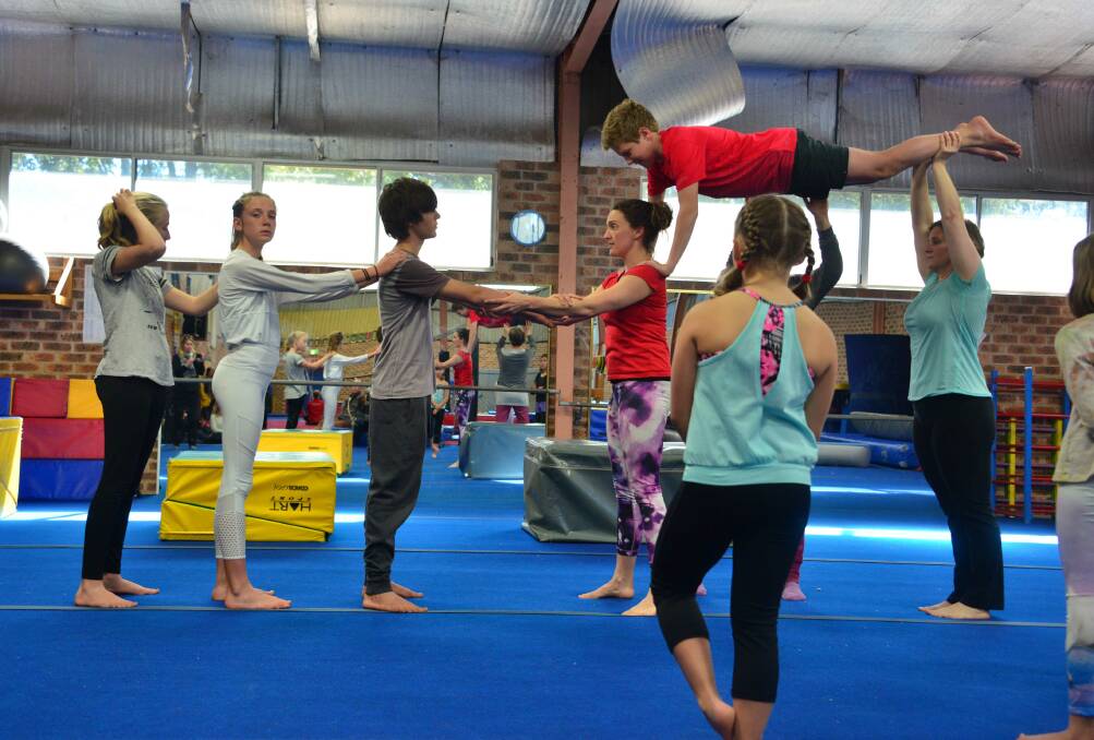 Lift: Trainer Karen Edelenbos puts members of Circartus through their paces. Photo: Julie Slavin.