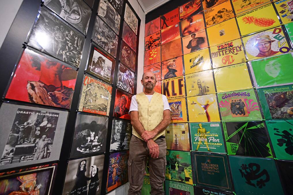 Off the record: Mark O'Brien with some of the albums on show at the Manning Regional Art Gallery. Photo by Julie Slavin.
