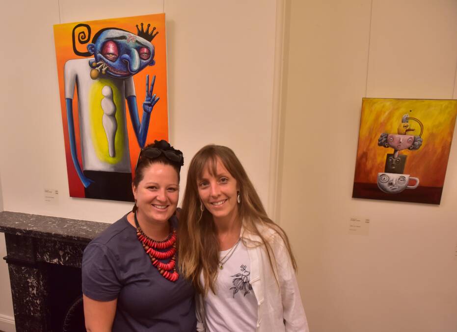 Art on show: Abra Hickson and Brooke Carbury enjoy the Robbie Crane exhibition at Manning Regional Art Gallery. The exhibition is on until May 5. Photo: Julie Slavin.