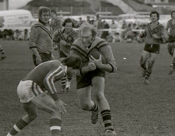 Barrie 'Carrots' Morrison bears down on Taree Old Bar centre Mark Walker during the 1978 major semi-final. Rick Greenaway, David Watson and John McKeough are in the background. Old Bar won 6-4.
