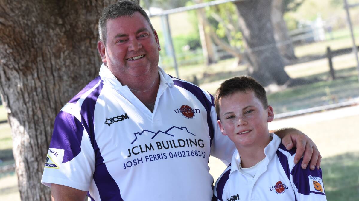 Well done dad: Jake with his dad, Bevan after Bevan scored a century in the third grade clash against Old Bar.