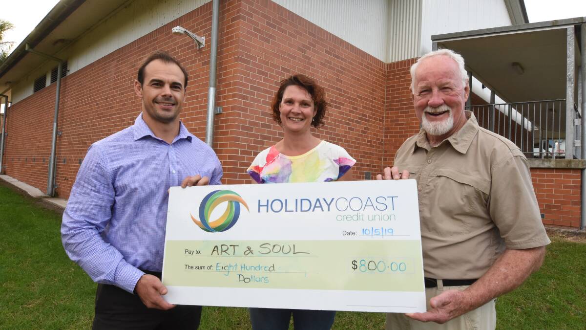 Jillian Oliver and Ron Hindmarsh from Art and Soul accept the donation from Mick Sullivan.
