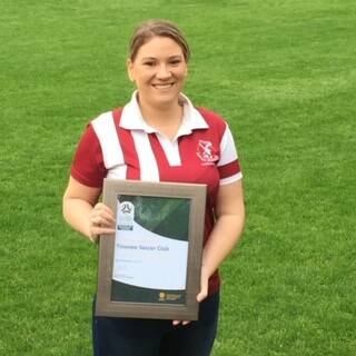A proud Tinonee Soccer Club secretary Kascie King and the club's 5 star rating.
