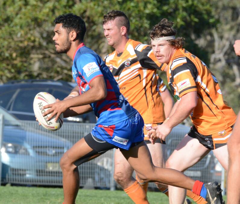 Wingham's Michael Rees gives chase to Wauchope halfback Tristan Scott. Rees has been named in Wingham's first and reserve grade sides for this weekend.