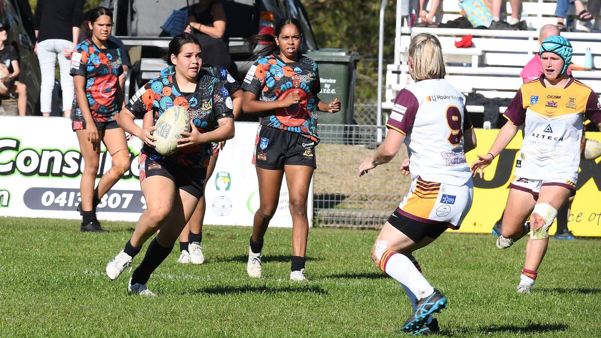 Tquile Singh takes the ball up for the Group Three Indigenous All Stars women's side in the clash against Group Three All Stars last season at Wingham. Picture Scott Calvin