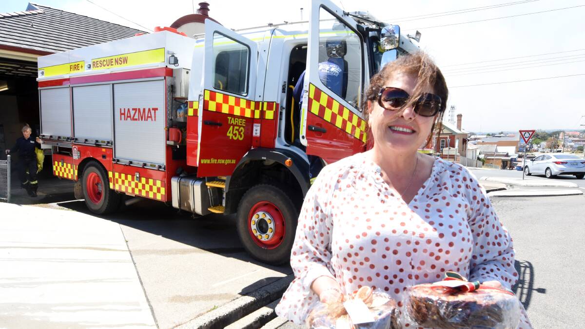Mon Saad called at the Taree Fire Station on Saturday morning with Christmas cakes to help the fire fighters. She was then making a call to the evacuation centre at Club Taree.