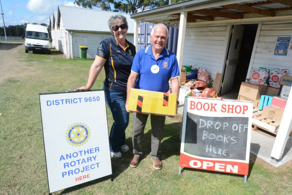 Rotarians Sharon Newell of Taree North and Bob Clarke of Wingham were on duty in September when the book shed reopened.