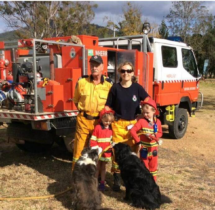 Wherrol Flat Rural Fire brigade captain Nick Hilverda, volunteer Lyn Heher and her children Blossom and Indigo.