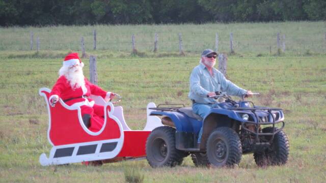 Santa arrives by sleigh at Wherrol Flat’s Christmas party