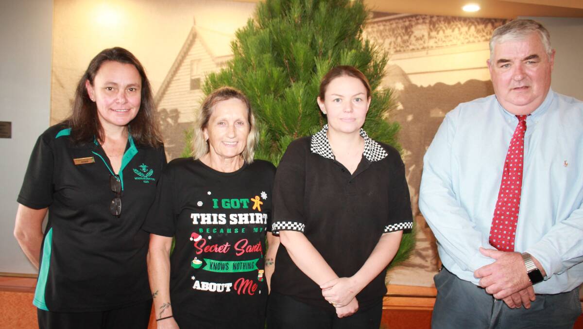 Before the event, from left Renee Kelly, Heather Moore, Danielle Treadgate and CEO Dean McCarthy in front of Christmas tree in Wingham Services Club foyer.
