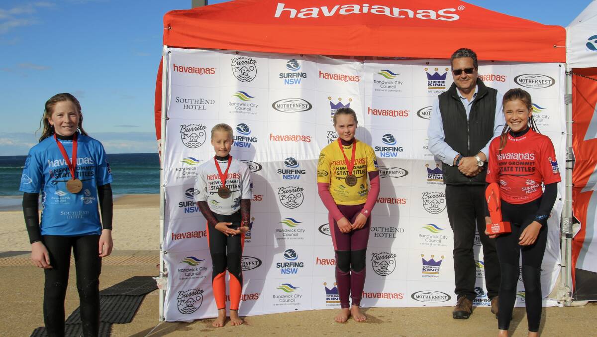 Under-12 girls winner, Gerringong's Lucy Darragh (right), with the other placegetters in her category. Picture: Ethan Smith/Surfing NSW