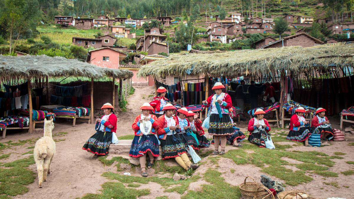Major tour companies and travellers are giving more consideration to how their trips affect local communities, such as this women's weaving collective in Peru. Picture: Michael Turtle