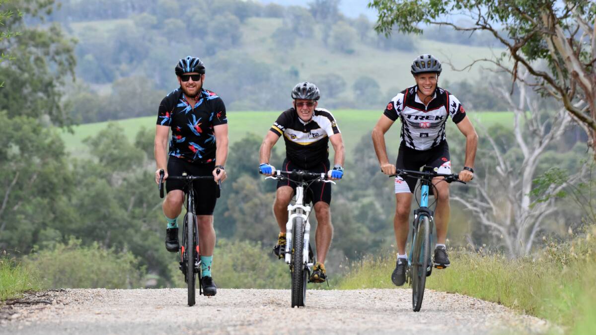 Together Tim Clark, Mike King and Nick Fell explore a new area to ride in Bindera, west of Gloucester, which offers sweeping views of the area. Photo Scott Calvin