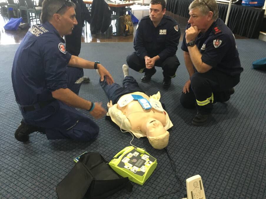 Wingham NSW Fire and Rescue captain David O'Donnell (right) takes part in the Community First Responder training with NSW Ambulance trainers and paramedics.