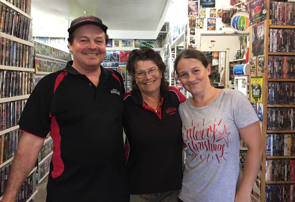 Still going: Wingham Movieland's John and Mandy McKay with their daughter Belinda. All the McKay children have worked at the store over the last 26 years.