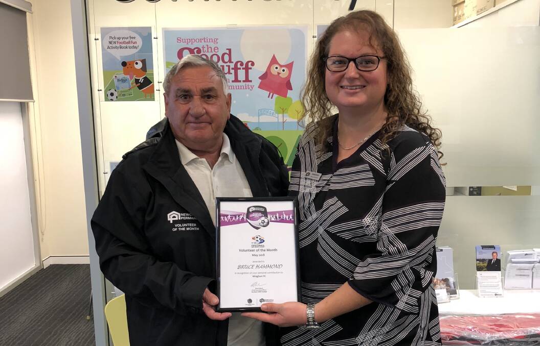 Taree Newcastle Permanent branch manager Vanessa Byma presenting Bruce Hammond with the Football Mid North Coast’s Newcastle Permanent Volunteer of the Month award. 