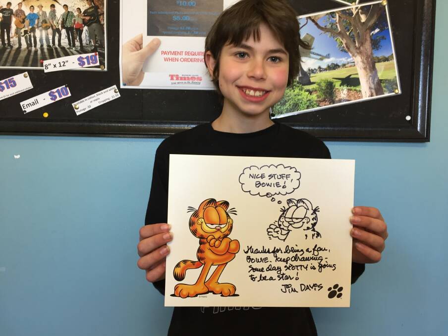 Bowie Reynolds of Wingham with his signed sketch of Garfield by Garfield creator Jim Davis.