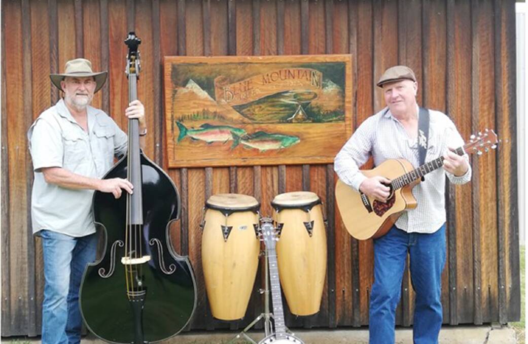 Darren Swannack and Gary Spicer are two of a trio of local musicians in the recently formed Rusty Hinges Band.