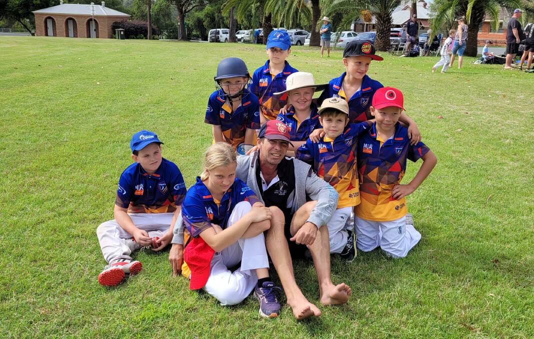 Wingham Lauders Real Estate Under 10's celebrating winning their last cricket match of the season in Central Park. 