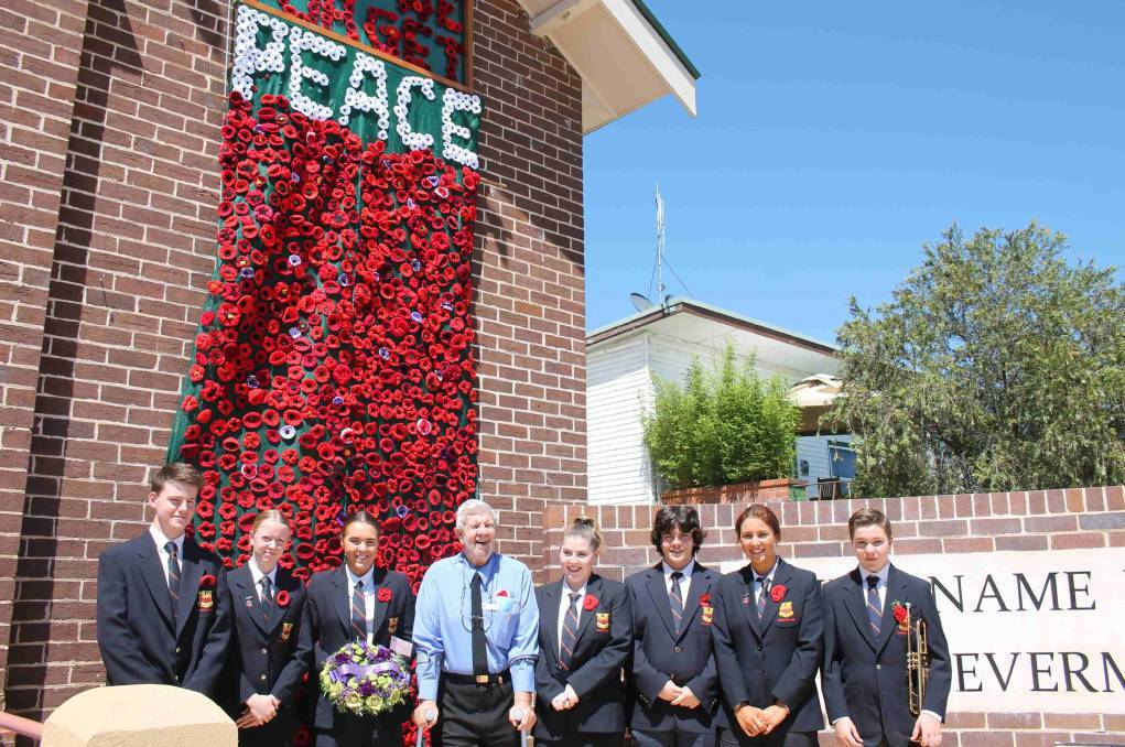 Wingham High School students join Ron Irwin on Remembrance Day 2018. From left Ryan Kriss, Layne Watson, Emma Scowen, Ron Irwin, Ellyse O'Connor, Harley Pike, Rawai Poini and Lincoln Harrell.