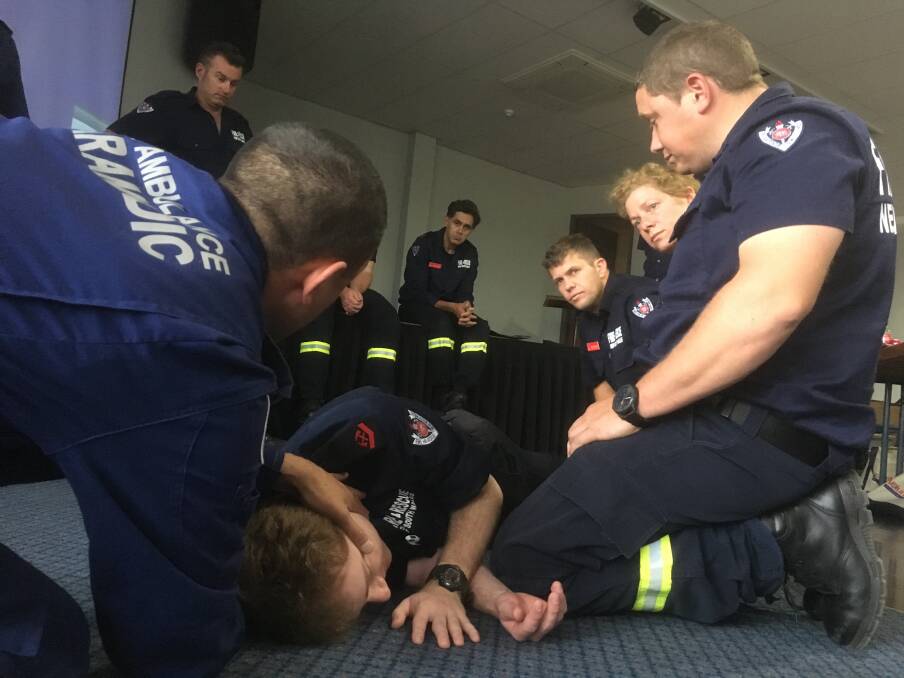 Wingham firefighters during Community First Responder training with NSW Ambulance personnel.