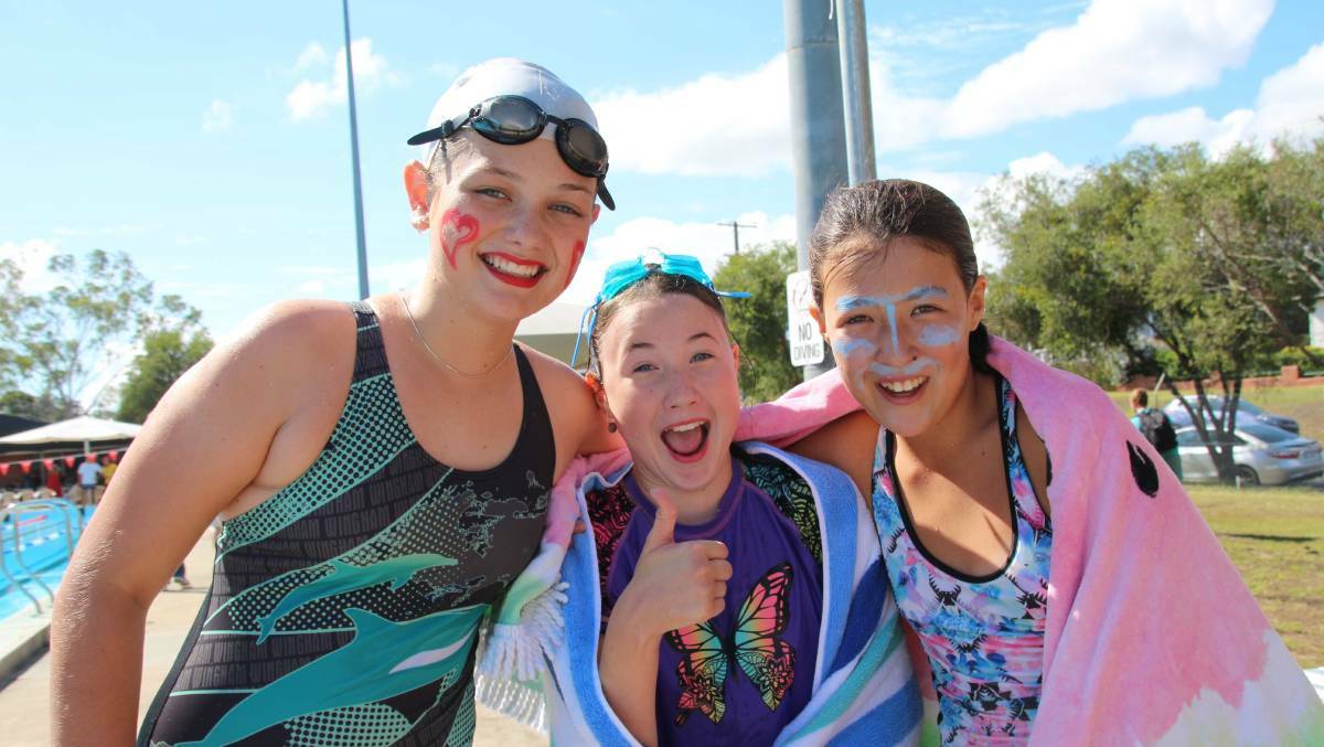 Community favourite: Amelia Hansen, Miranda Frendin, and Lea Urquhart enjoying a school swimming carnival at Wingham Pool.