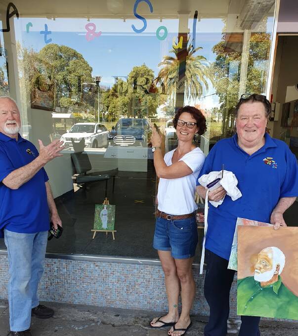 Ron Hindmarsh, Jillian Oliver and art group member Dennis Simpson in front of the new Art and Soul Gallery in Wingham. Dennis has been practicing painting portraits and he is holding a portrait he did of Ron.