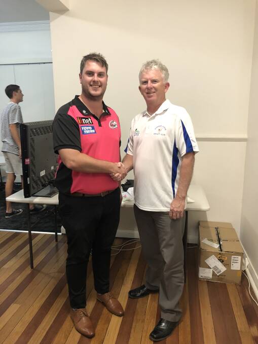 Luke Miner, Mid North Coast Cricket Manager congratulates club president Dennis Smith on the club receiving a GrassRoots Cricket grant.