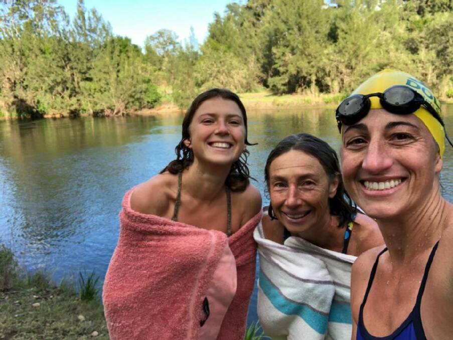 Cool dip: Burrell Creek Beauties Babette and Belinda Robertson with Liliana Kellett after a brisk swim in the Manning River. Photo: Submitted