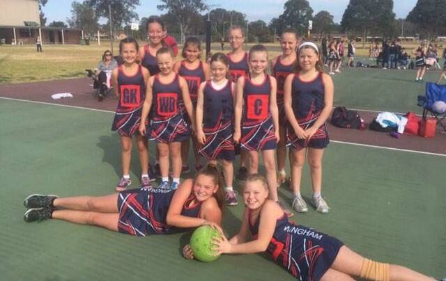 Great achievement: It was a close game for the Wingham Wild Girls against CJ's Stones Oysters.