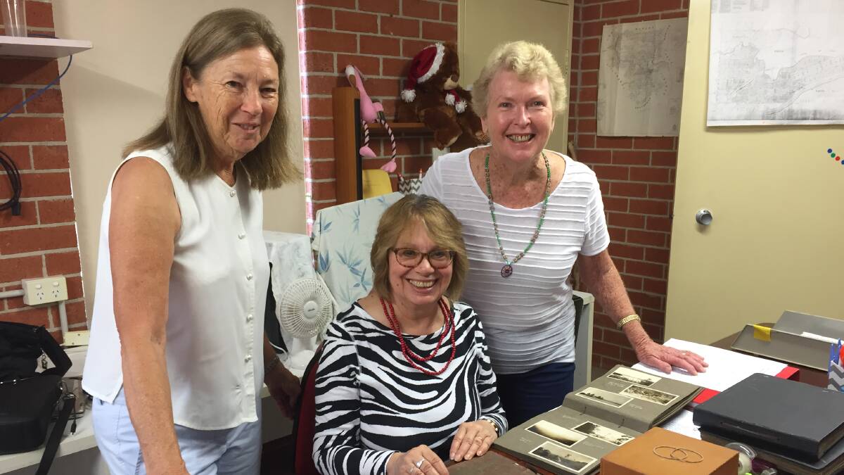 Heritage significance: Assessing the archives at Wingham Museum for national significance are Manning Valley Historical Society archivist Kaye Wallace with Dr Roslyn Russell and MVHS president Barbara Waters.