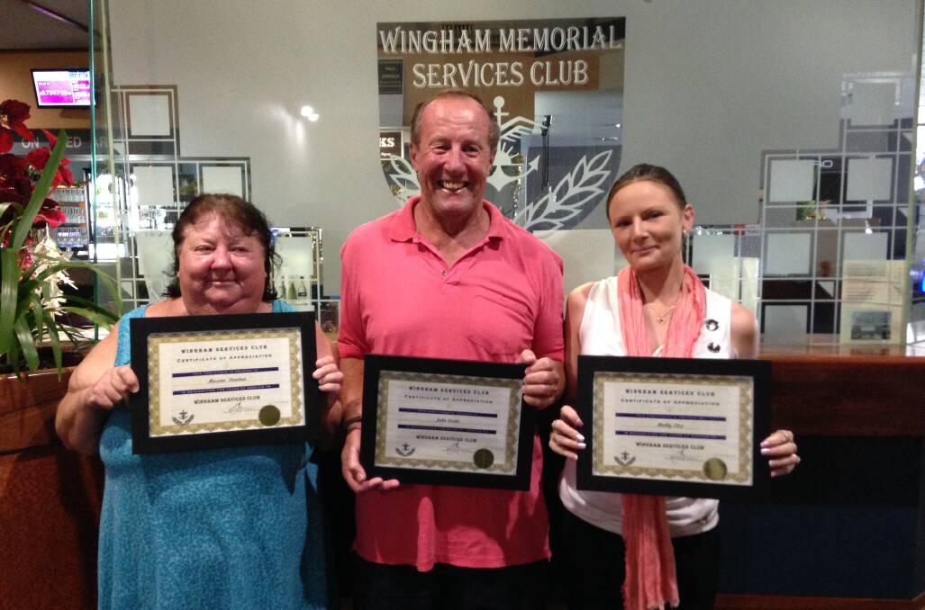 Maxine Nowlan, John Earle and Holly Else with their 10 year service certificates.