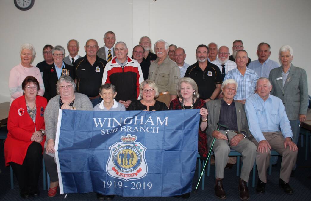 Wingham RSL Sub-branch members with the new flag after the September meeting.
