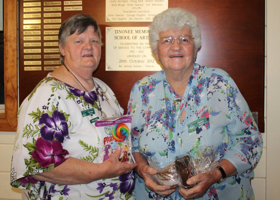 The Doorkeepers: Team and Hall Committee members Pam Muxlow and Helen Bennett with their prizes. And thank you to Pam on the 30th anniversary of Tinonee Topics.