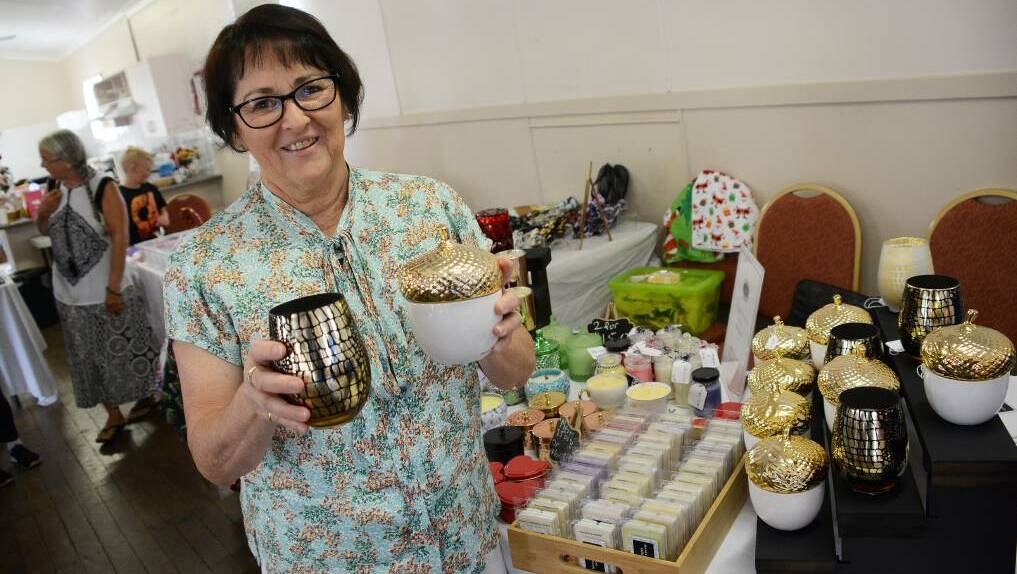 Setting the mood: Maree Murray selling candles at the December Burrell Creek Hall market. Photo: Scott Calvin