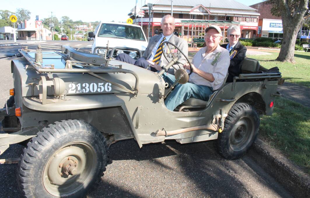 Special: John Cooper drives Wingham RSL Sub-branch members Brian Willey and Rhonda Delaney to Anzac services at Wingham Brush School in his 1944 Jeep.