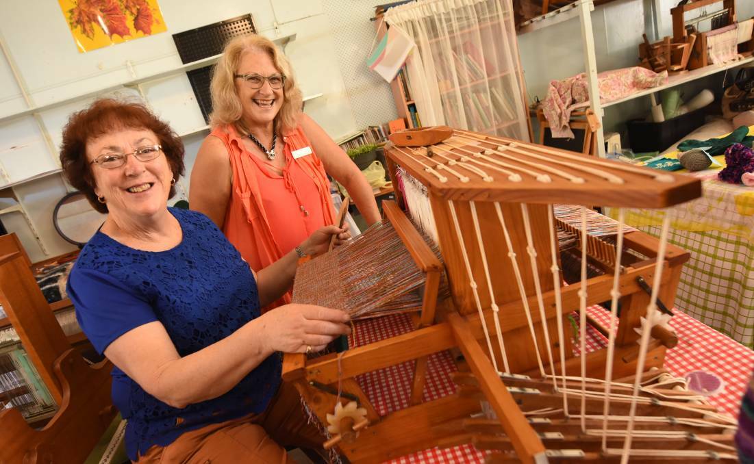 Yvonne Prince and Sharon McCartney from Wingham Spinners and Weavers Group at the loom. The club meets every Wednesday.