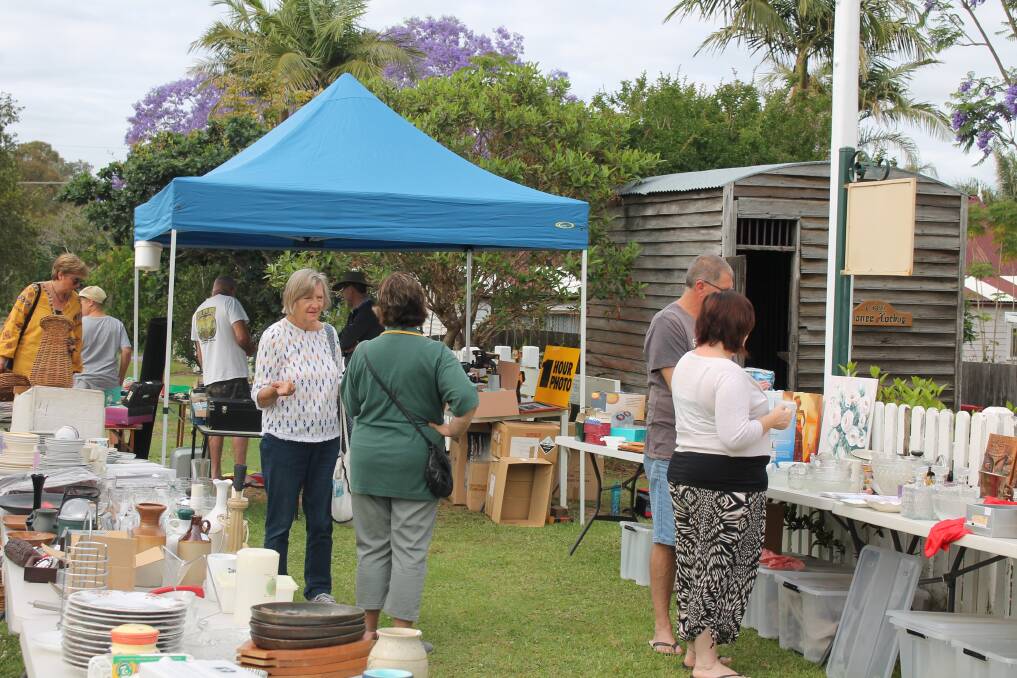 Bargain hunters: People browse through the many items on offer at Tinonee Historical Society’s garage sale. Photos supplied.
