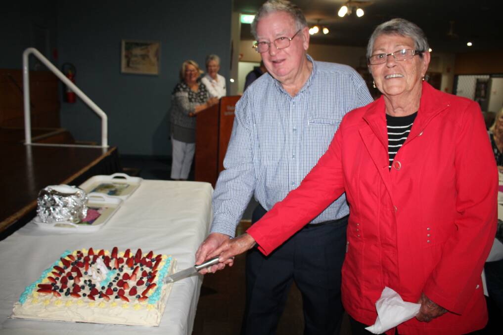 Wingham Brush Birthday: Club members John Butler and Beryl Dawson had the honour of cutting the birthday cake at the 31st birthday of Wingham Brush Club at Wingham Services Club.