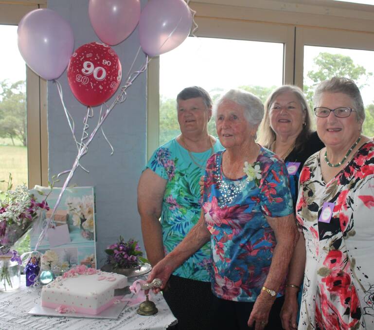 Gwen Greaves cuts her birthday cake surrounded by nieces, from left Pam Muxlow, Di-Greaves-Hayne and Helen Cox, at her 90th birthday celebrations at Bowers.