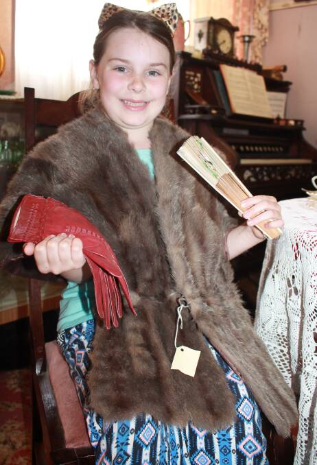 Zoe Corner enjoyed dressing up in the fur stole with gloves and fan during her Museum visit.