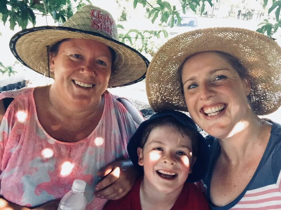 Taree Community Garden working bee co-ordinator Bree Katsamangos (right) with her son, Will, and regular volunteer Laura Price. The trio are keen to see more friendly faces at this Sunday's working bee.