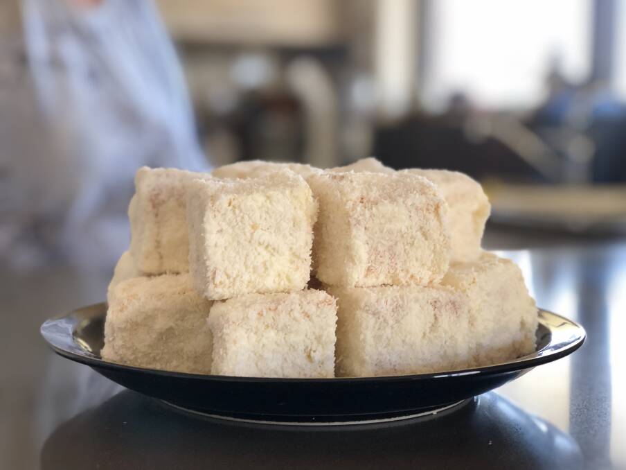 Albino lamingtons are a not-too-sweet cake that is soft and moist with the subtle flavour of coconut and light cream. Photo: Ainslee Dennis.