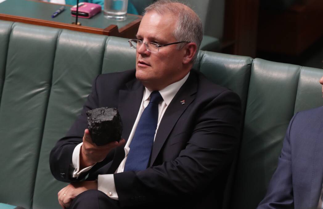 Wrong side of history: Treasurer Scott Morrison with a lump of coal during question time at Parliament House in February, 2017. Photo: Andrew Meares